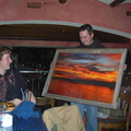 Shaggy showing (little?) Woody the barnwood framed picture of a Sherridan sunset donated by Little Laker and won by big Woody
