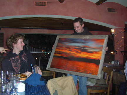 Shaggy showing (little?) Woody the barnwood framed picture of a Sherridan sunset donated by Little Laker and won by big Woody