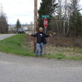 Can you believe this?!  Wayne posing under the Gook Road sign on the way to Dragon Lake!