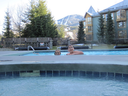 Me in the hot tub, boys in the pool at the base of Whistler