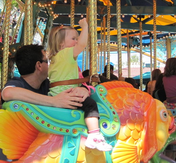 RM enjoying her first ride on the King Arthur Carrousel