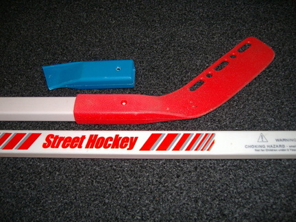 Broken children's toy street hockey sticks &quot;before&quot;.