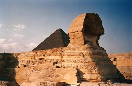 Sphinx side view to the pyramids with the evening light.